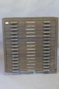 A metal tool chest of sixteen slide drawers and galleried top, mid C20th, 33" x 18" x 36"