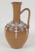 A Doulton stoneware jug of classical form with applied garland decoration