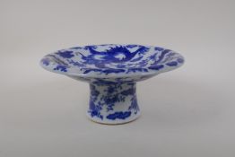 A blue and white porcelain stem dish with dragon decoration, Chinese Kangxi character mark to