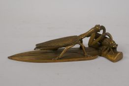A Chinese bronze scroll weight in the form of a mantis preying on a cicada, 7½" long