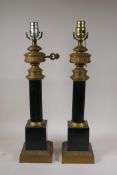 A pair of empire style brass column lamps, 22" high