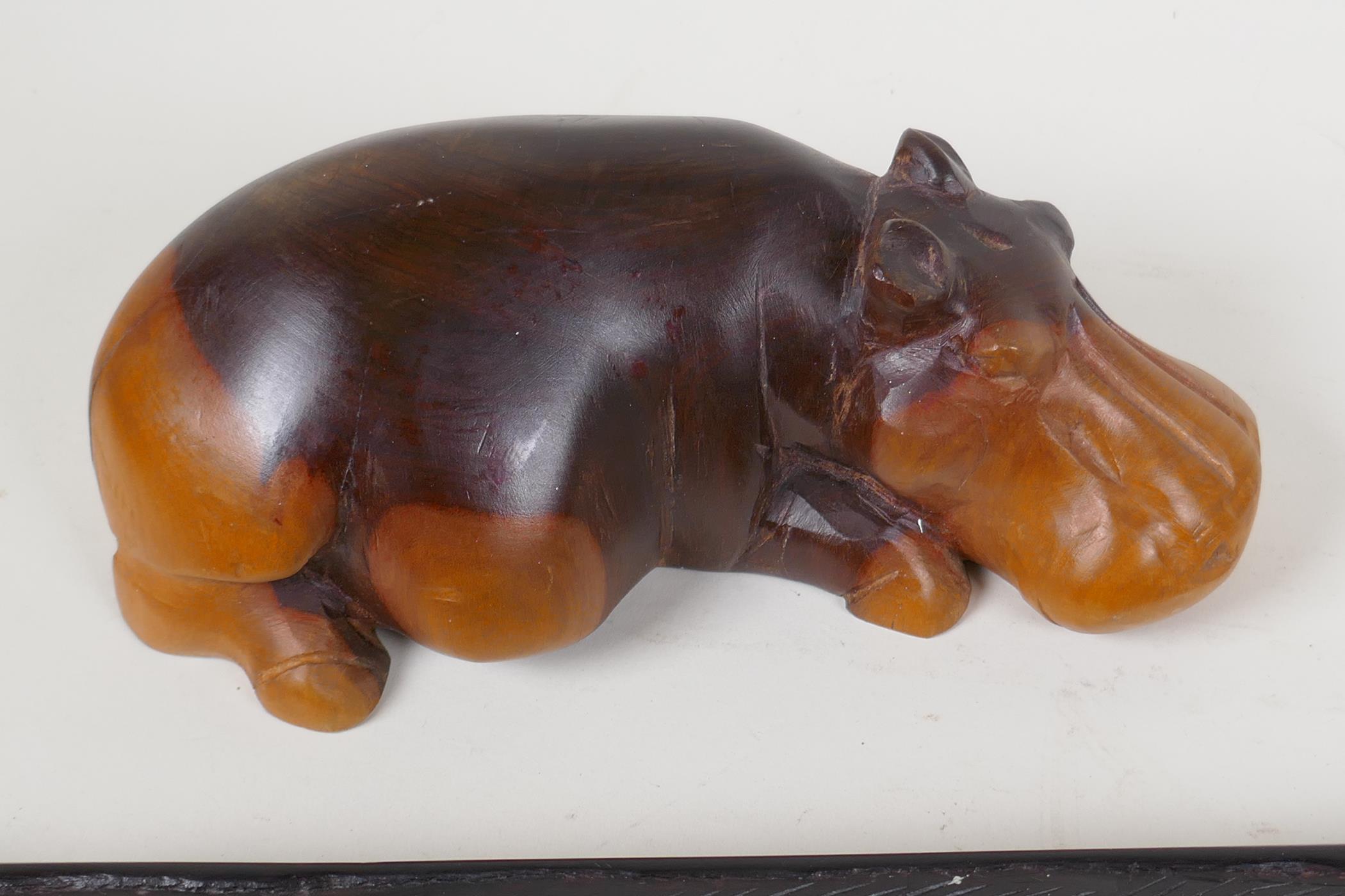 An African hardwood Bao Mancala board carved with rhinos, 13" long, and an African carved hardwood - Image 2 of 5