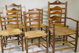 A set of six (4+2) ash ladderback chairs with rush seats, late C18th/early C19th