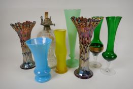 A quantity of decorative glass vases including carnival glass and an oil lamp, largest 11" high