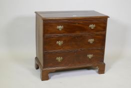 A C19th mahogany chest of three long drawers, with crossbanded top, raised on bracket supports,