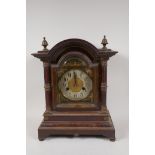 A C19th Ting Tang mahogany cased bracket/mantel clock in an architectural moulded case, the movement