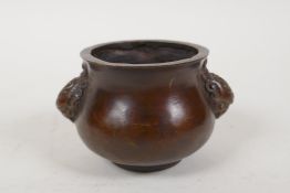 A Chinese bronze two handled censer, impressed 4 character mark to base, 3" diameter