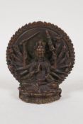 A Sino Tibetan bronze figure of a many armed deity, 3½" high