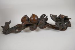 A rootwood ruyi carved with bats and peaches, 16" long