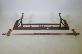 A C19th steel and copper fire fender, 52" x 14" x 12" high, and a brass curtain pole, 67" long
