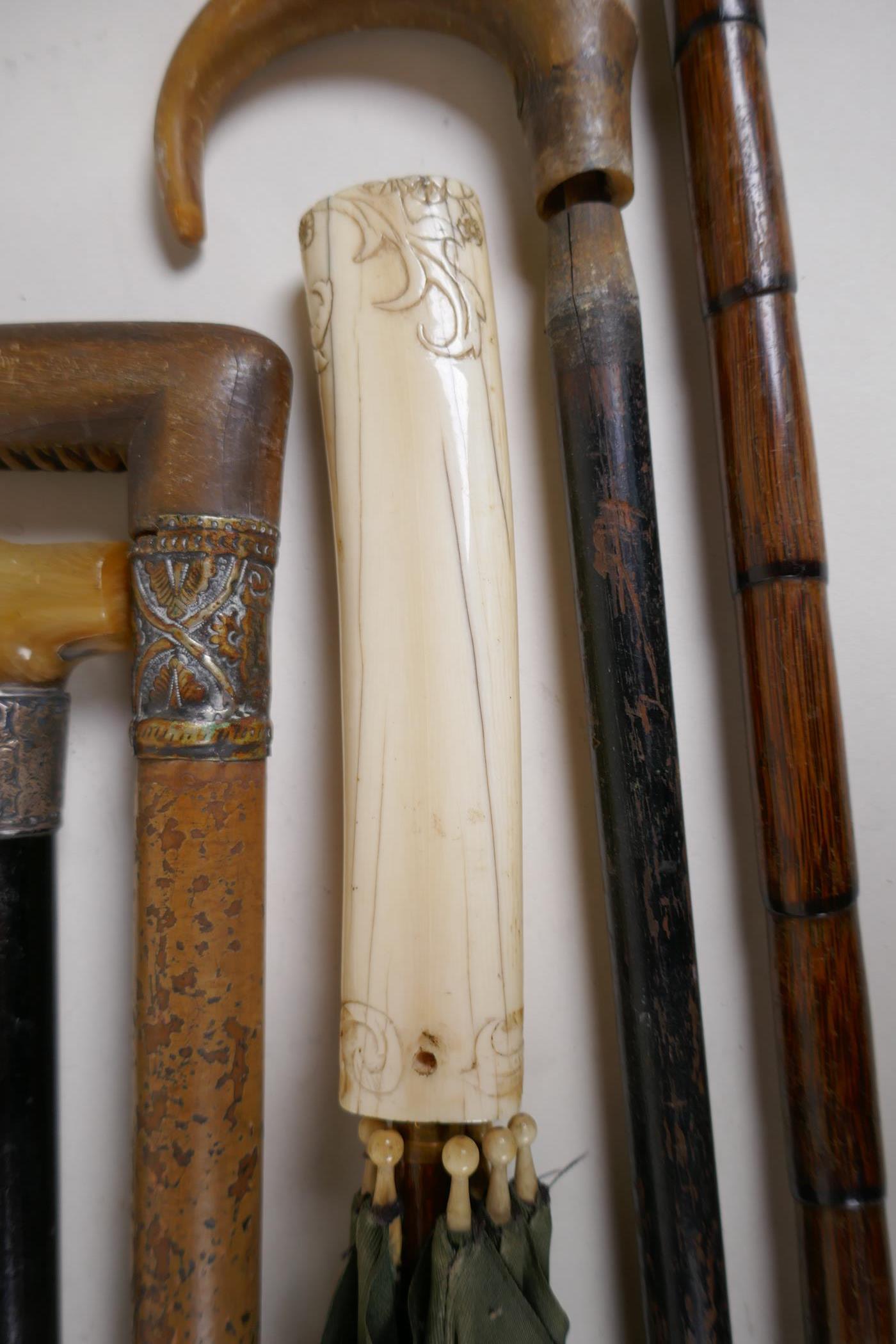 Four horn handled walking sticks with silver ferrules, longest 36", and two others and a carved bone - Image 3 of 4