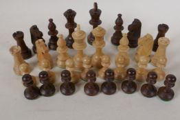 A turned wood chess set, kings 3½" high