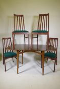 A 1970s veneered and stained dropleaf dining table and four stained beech high back dining chairs,