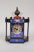 A brass cased mantel clock, decorated with printed enamel panels and a cloisonne knop, 8" high