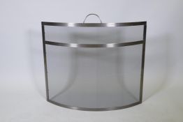 A contemporary metal spark guard, 29" x 28"