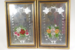 A pair of late C19th/early C20th bevelled glass mirrors with reverse painted and cut decoration,