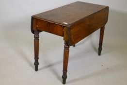 A C19th mahogany twin flap Pembroke table with single end drawer on ring turned supports, 25½" x 35"