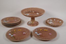 A Villeroy & Boch majolica part dessert service including a tazza, six cake plates and three side