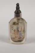 A Chinese reverse decorated glass snuff bottle depicting an erotic scene, character inscription