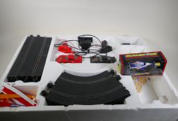 A Porsche Turbo Scalextric racing set, and an additional F1 car, boxed