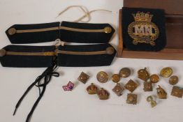 A box of military buttons, badges and epaulettes