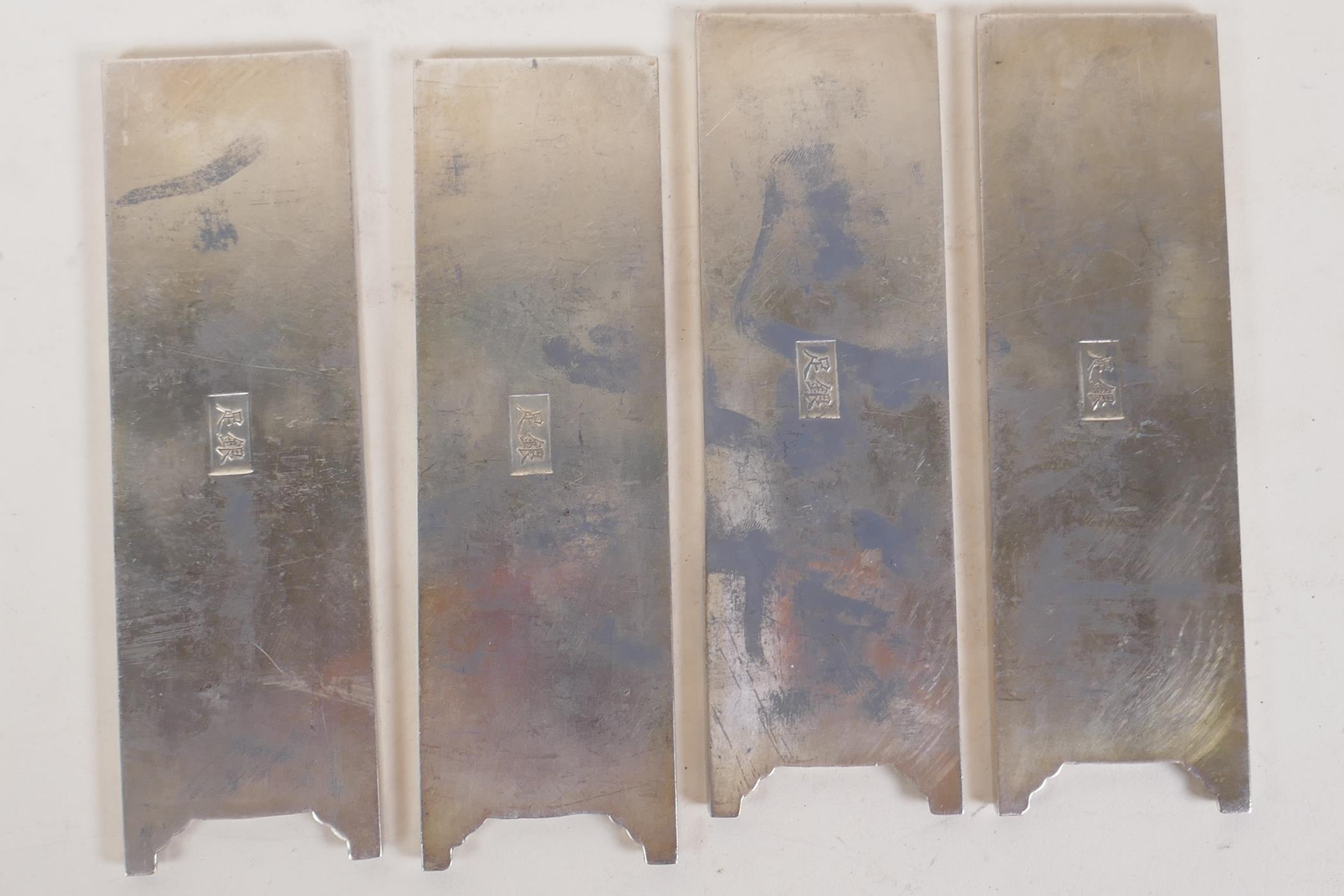 A set of four Chinese white metal scroll weights in the form of screen panels, decorated with garden - Image 2 of 2