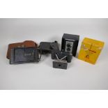 A Kodak Brownie Reflex camera in original box, an Actus Ansco Vest pocket camera and a Kodak