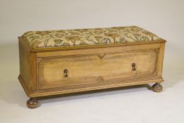 An oak ottoman with a single drawer, adapted, lacks rear foot, 47" x 17", 20" high