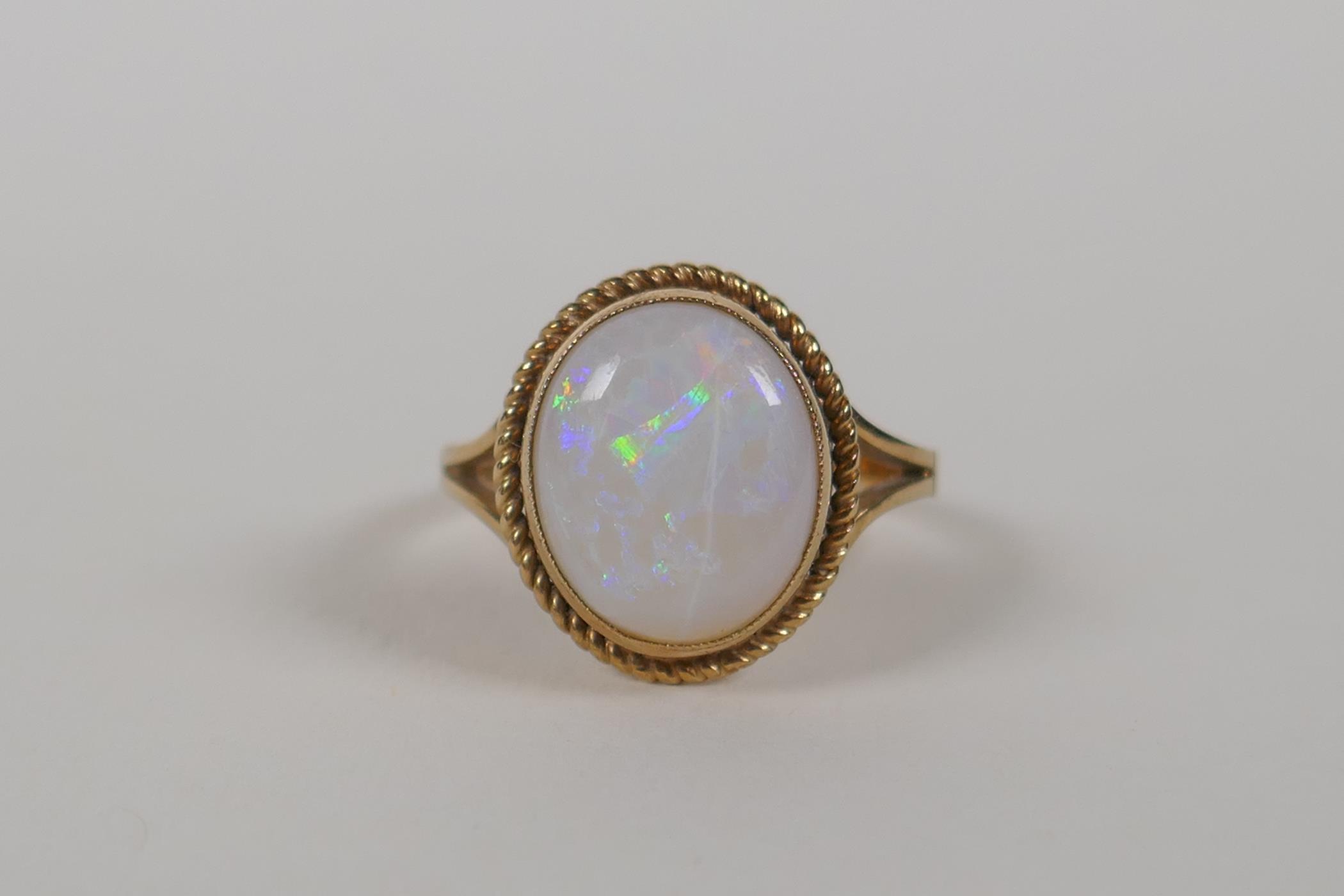 A 9ct yellow gold and opal set ring, size L/M - Image 2 of 3