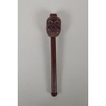 A Japanese carved hardwood Noh mask incense holder, signed, 10½" long