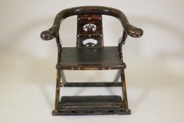 A Chinese folding bow back chair, with lacquered decoration and copper mounts