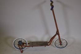 A vintage scooter with combined brake and stand