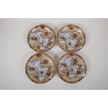 A set of four Japanese Meiji period Kutani porcelain saucers in the Satsuma style depicting