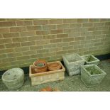 A quantity of terracotta and concrete garden pots