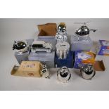 Twelve silver plated money boxes including cars, helicopter, animals etc