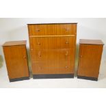 A mid century teak veneered chest of four long drawers and a matching pair of bedside cupboards, 31"