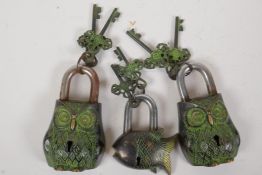 Two ornamental brass and steel padlocks in the form of owls, 5" long, and another of a fish