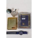 A sterling silver photo frame, 3½" x 2½", together with a new gilt metal cigarette case, a silver