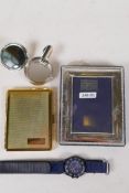 A sterling silver photo frame, 3½" x 2½", together with a new gilt metal cigarette case, a silver