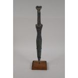 A Chinese archaic style bronze dagger, on a display stand, 15½" high