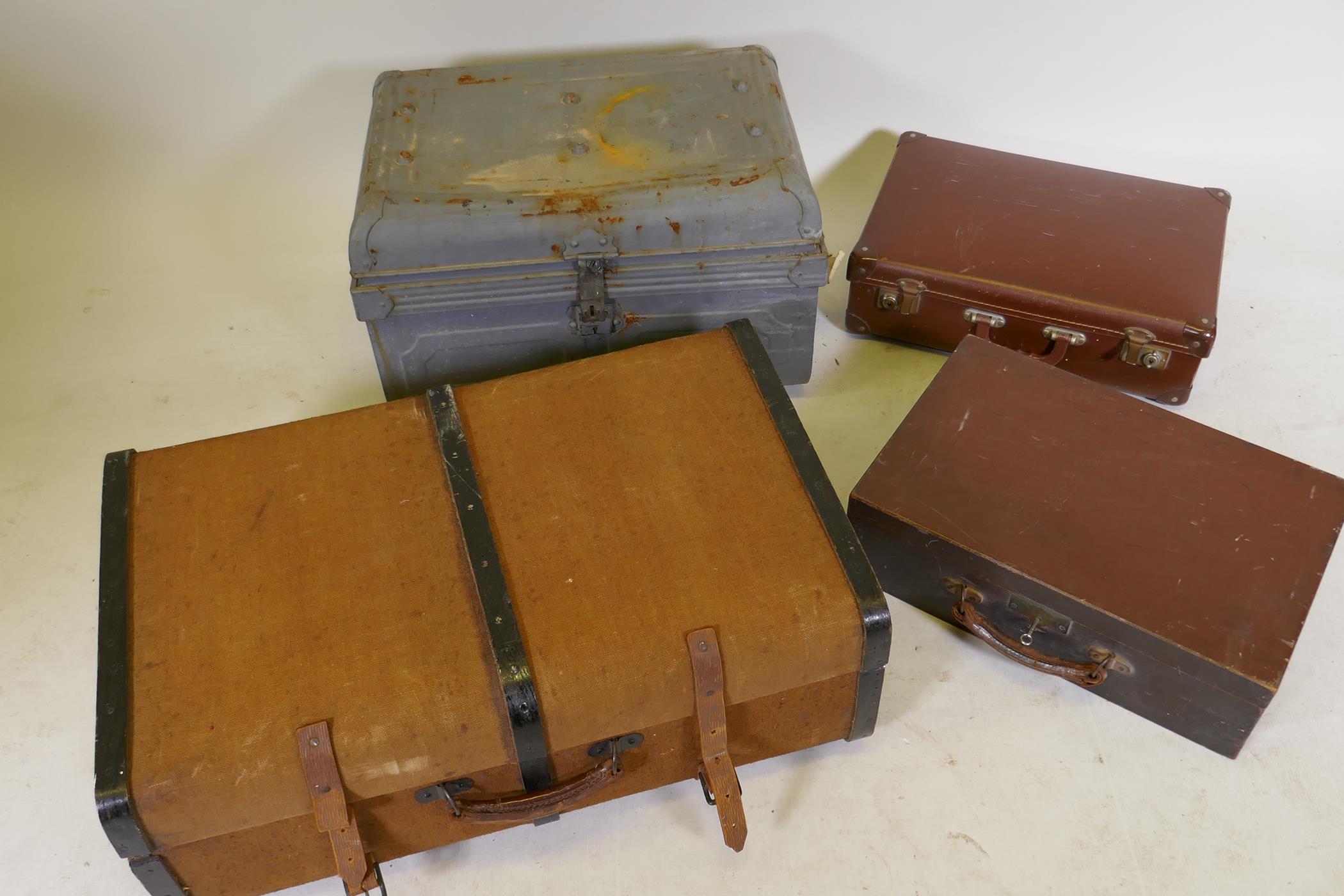 A dome top metal trunk, 22" x 15" x 13", a vintage fabric covered cabin trunk, a small wooden case