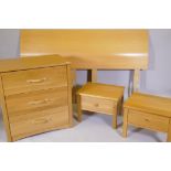 An 'Aspace' three drawer oak chest, 30" x 20" x 32", two oak bedside tables and a bedhead