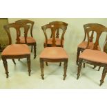 A set of six Victorian Grecian style mahogany dining chairs, with pierced splat backs, raised on