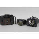 Three rare vintage cameras, an Ensign Midget, an Agfa PD16 Clipper, and an Olympic Olynar special