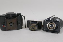 Three rare vintage cameras, an Ensign Midget, an Agfa PD16 Clipper, and an Olympic Olynar special
