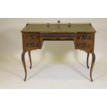 A Victorian mahogany desk of four drawers with moulded fronts and brass handles, the top with