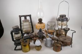 A quantity of oil lamps, storm lamps and blow lamps