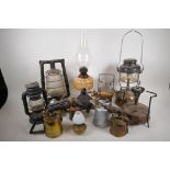 A quantity of oil lamps, storm lamps and blow lamps