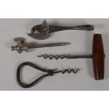 Two antique cork screws, a 'Bully Beef' tin opener and a Champagne tap