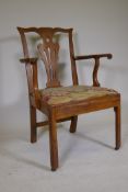 An C18th elm Chippendale style elbow chair, with pierced back splat and scrolled arms, and drop in